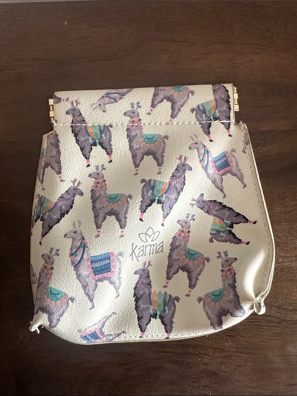 Karma Cream Change Pouch with Colorful Llama Print - clamshell opening